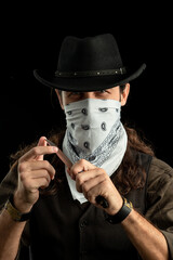 Cowboy with guns. Studio shooting