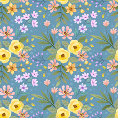 Fototapeta na wymiar Colorful flowers, and leaves on a blue background. Abstract floral seamless pattern design for backdrop, wrapping paper, fabric, textile, and wallpaper.