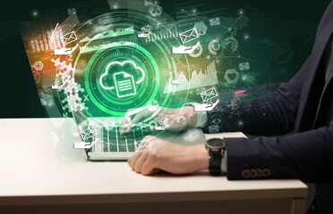 Business hand typing on a modern laptop