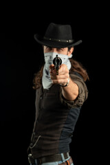 Cowboy with guns. Studio shooting