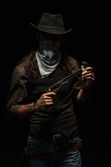 Cowboy with guns. Studio shooting