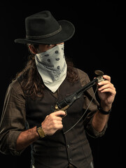 Cowboy with guns. Studio shooting