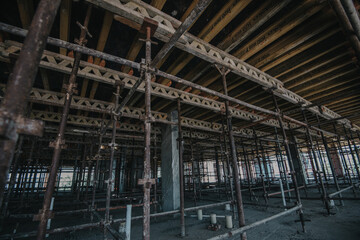 Construction site of multi-storey building with concrete slabs and columns. Men at work .