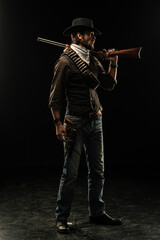 Fototapeta na wymiar Cowboy with guns. Studio shooting