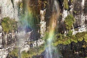 Fototapeta na wymiar Colorful rainbow in waterfall at the forest Landscape 