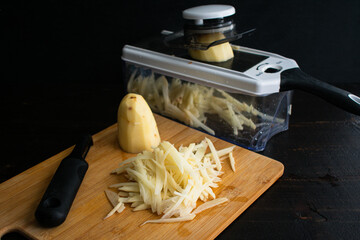 Shredding Potatoes with a Mandoline: Using a mandoline to julienne russet potatoes