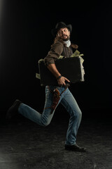 Cowboy with guns. Studio shooting
