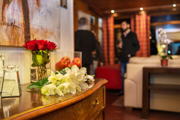 Flower arrangement with a group of unrecognizable people