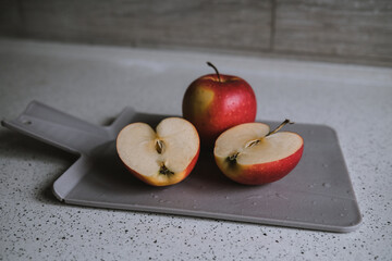 red apple on a cutting board. Shape of the heart