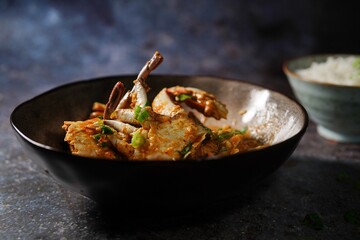 Homemade Singapore chilli crab served with jasmine rice, selective focus