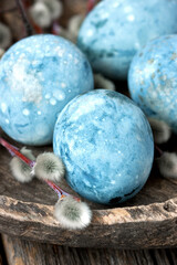 Easter composition with colored eggs on wooden  background, selective focus with  shallow depth of field