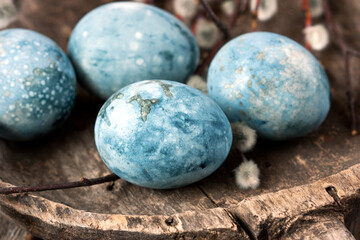 Easter composition with colored eggs on wooden  background, selective focus with  shallow depth of field