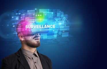 Businessman looking through Virtual Reality glasses