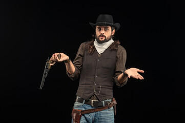 Cowboy with guns. Studio shooting