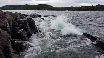 Waves bursting onto the coastline of the Lake Superior