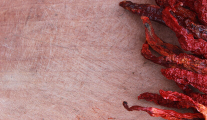 red hot chilies on the wooden table for food background. Copy space for your text. 