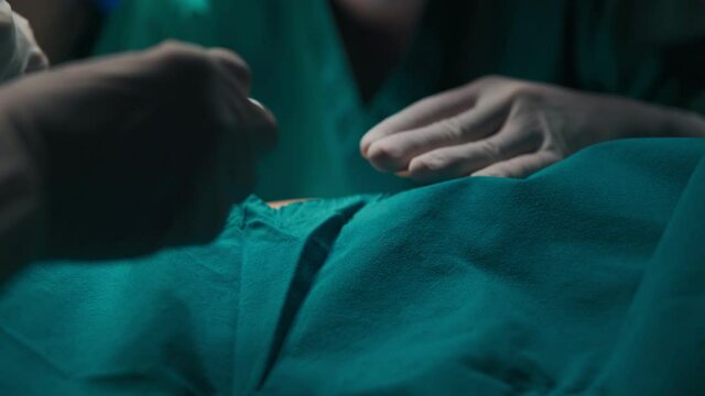 B roll of Demonstration or simulation of surgery in a hospital.  Asian doctor in the operating room for surgical. Surgery beauty clinic in hospital healthcare concept. Beauty clinic and health concept