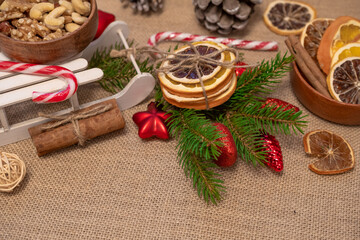 photography of a christmas background with christmas toys, dried oranges, cinnamon and chocolates