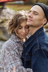 young couple in love in the park. a romantic walk in the open air. relationships between men and women