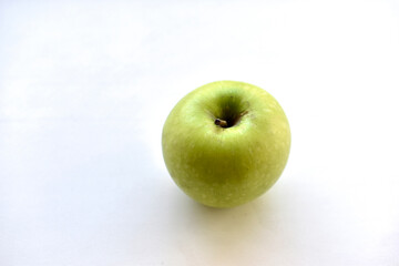 Green apple on white background with shadow