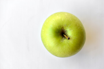 Green apple on white background with shadow