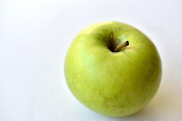 Green apple on white background with shadow