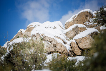 rock in the mountains with snow