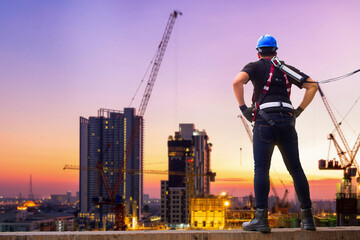 Fototapeta na wymiar construction workers at sunset