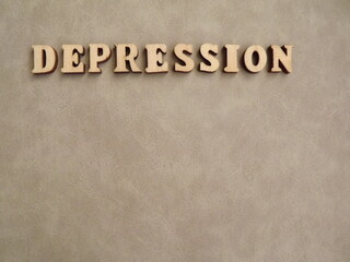 mental illness depression in wooden letters on a black background. High quality photo