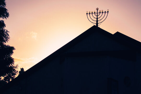 Menorah Silhouette On The Rooftop