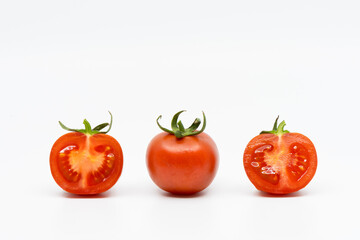 Whole Tomato and Two Halves of Tomatoes Isolated on White Background