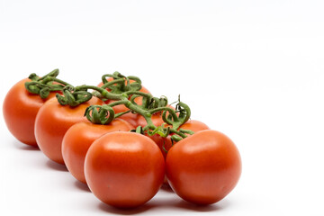 Fresh Tomatoes Isolated on White Background. Bunch of Fresh, Red Tomatoes with Green Stems
