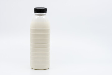 Bottle of Milk with Black Cap Isolated on White Background