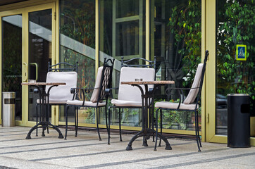 Fototapeta na wymiar Tables and chairs on terrace