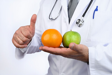 Health concept. Nutritionist doctor advises us to eat fruit. Healthy diet. 
