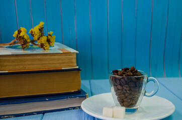 Still life with old books and cup of coffee