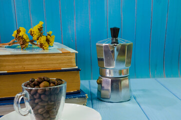 Still life with old books and cup of coffee