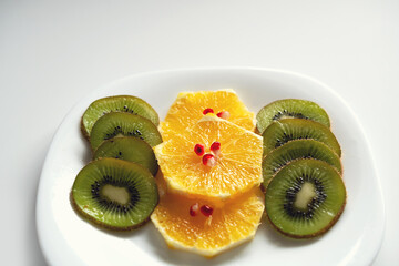 macro photography of sliced ​​oranges and kiwi