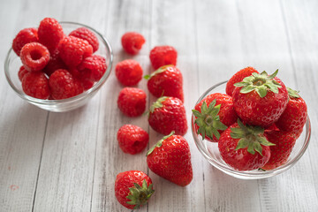 macro photography of strawberries and raspberries