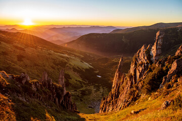 Scenic view of amazing sunset over mountain peaks
