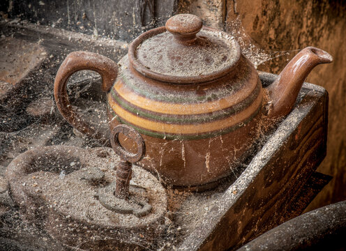 Old  teapot and padlock in abandoned workshop 2115