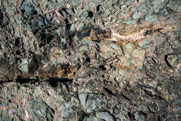 Colorful rock texture. Natural cracks void.