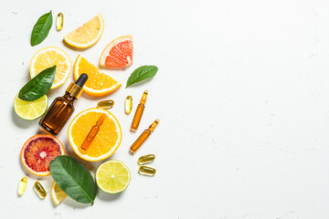 Vitamin C. Cosmetic products and fresh citrus fruits.