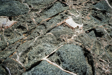 Colorful rock texture. Natural cracks void.