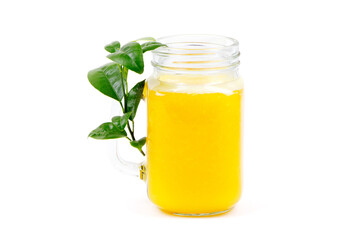 Orange juice and green leaves isolated on a white background.A glass of orange juice. Healthy food. Vegan food