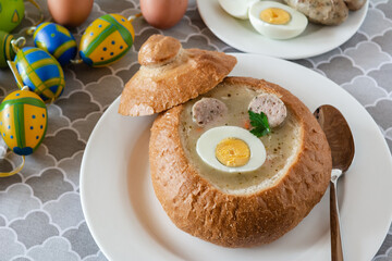 Traditional Polish soup Zurek with white sausage and egg. Popular Easter dish.