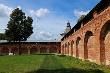 Fototapeta premium corner tower of old fortress Zaraysk Kremlin, Moscow Region, Russia summer view under bright blue sky