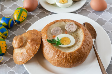 Traditional Polish soup Zurek with white sausage and egg. Popular Easter dish.