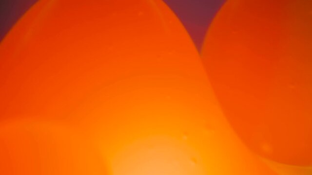 The closer look of the orange bubbles forming inside the water in Estonia