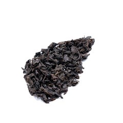 dry black tea heap isolated on white background. indian dried tea leaf cut out